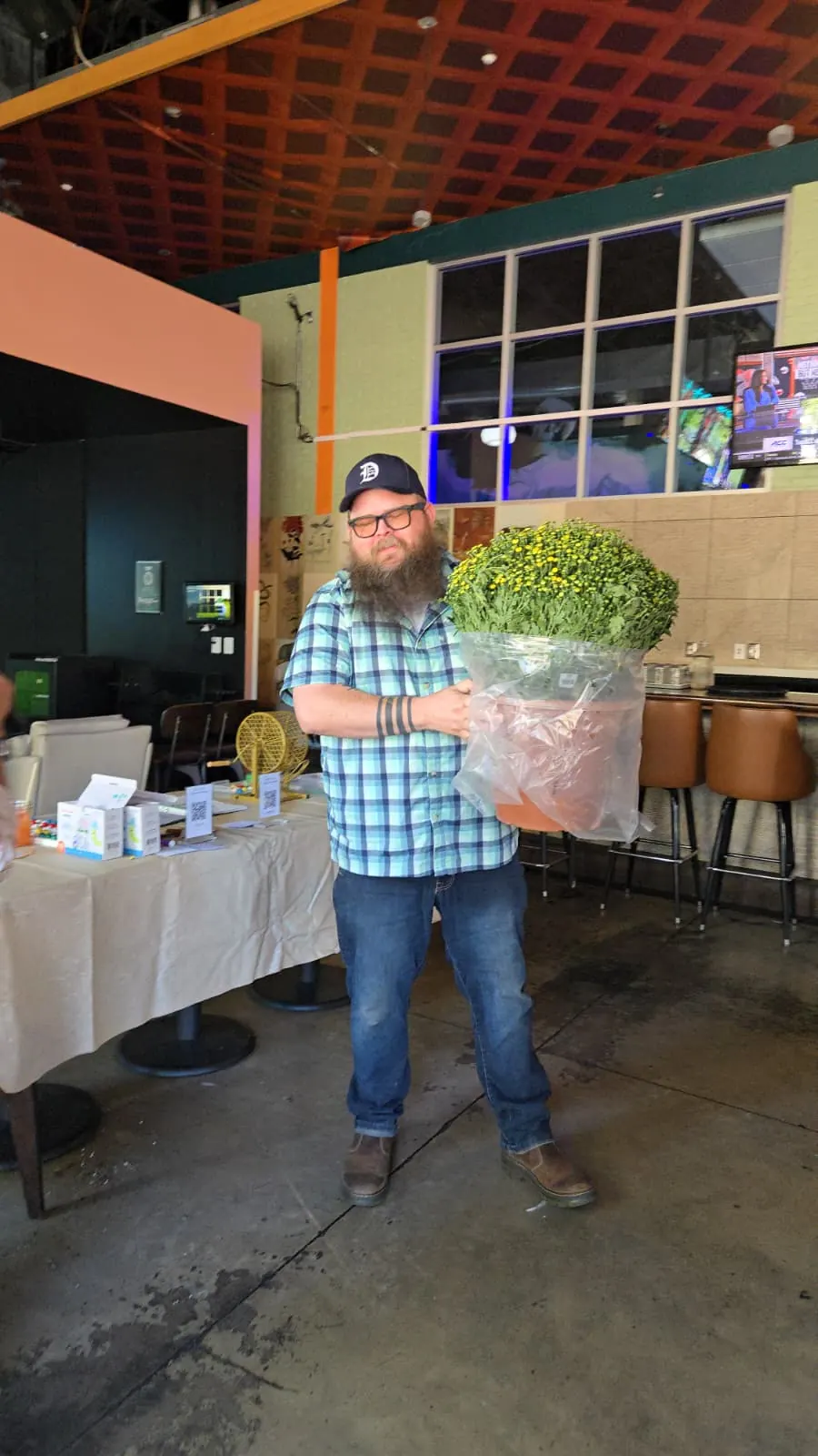 Happy Plant Bingo participants showing their plants at Punch Bowl Social
